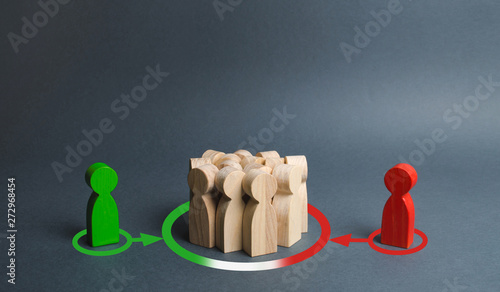 red and green figures of people influence the crowd. Pressure, influence on public opinion, communicating. influence of media oligarchic groups on the opinion of the population. change to their side photo