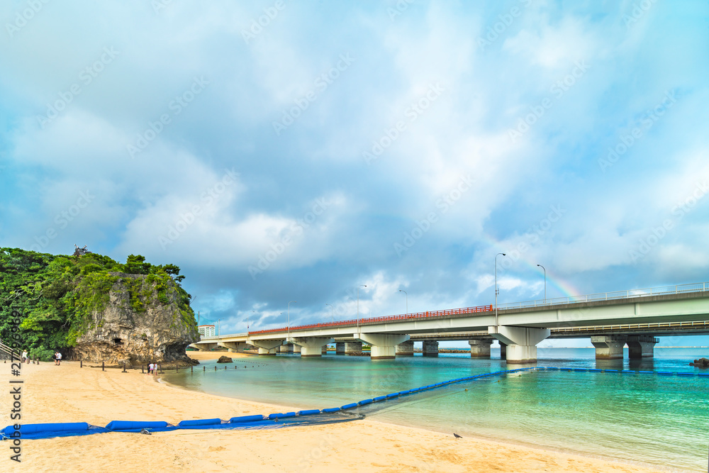 Rainbow landscape of the Shinto Shrine Naminoue at the top of a cliff overlooking the Naminoue beach and bridge of Naha City in Okinawa Prefecture, Japan.