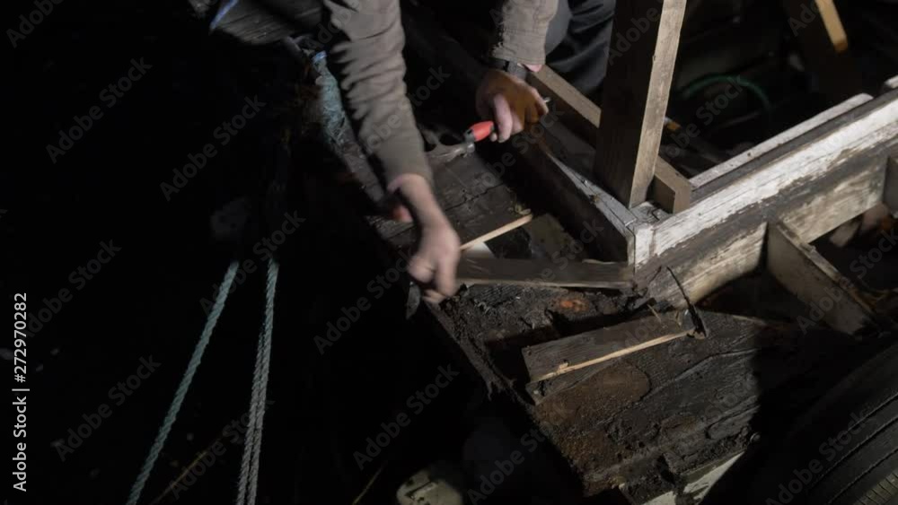Boat maintenance repair work removing rotten timber at night. Boat maintenance repair work removing rotten timber at night.