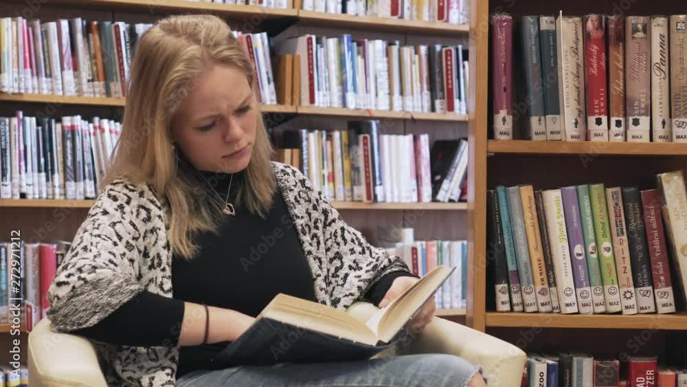 Sad emotions during reading a book, young caucasian girl Sad emotions during reading a book, young caucasian girl