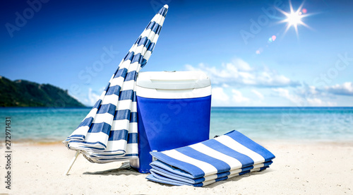 Summer background of beach with umbrella and ocean landscape. Sunny day and blue sky. 