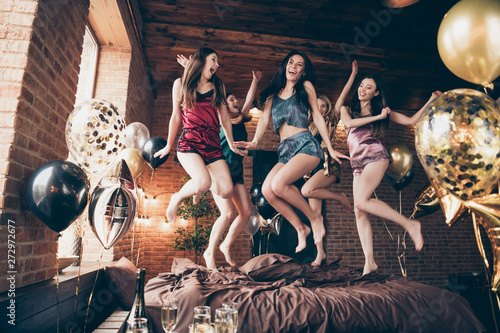 Low below angle full length body size view of nice attractive slim fit adorable cheerful crazy group having fun great free time in hostel loft industrial style interior room house indoors