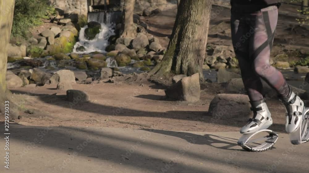 Kangaroo shoes workout in slow motion with copy space. Medium shot of legs and feet only. Kangaroo shoes workout in slow motion with copy space. Medium shot of legs and feet only.