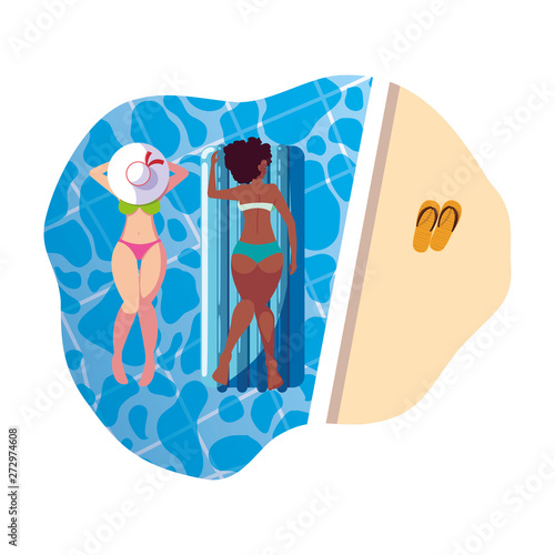 beautiful interracial girls with float mattress in water