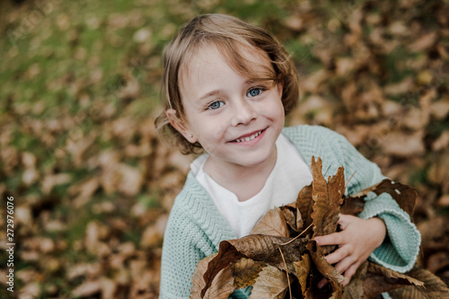 little girl in an autumn forest