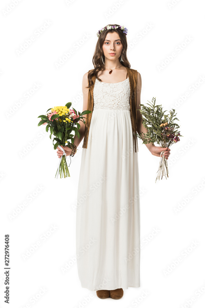 full length view of pregnant hippie woman in wreath holding flowers isolated on white full length view of pregnant hippie woman in wreath holding flowers isolated on white