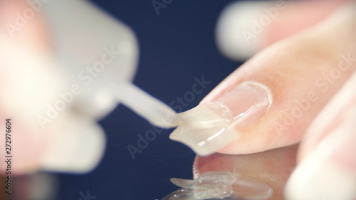 Long fingernails transparent polish manicure photo
