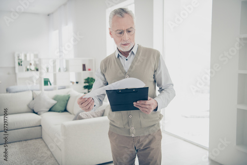 Close up photo attentive amazing he him his aged man arm hand pact realization skilled specialist reader notice details wear white shirt waistcoat pants comfy bright flat house living room indoors © deagreez