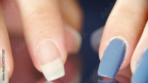 Long fingernails comparison between nude and blue photo