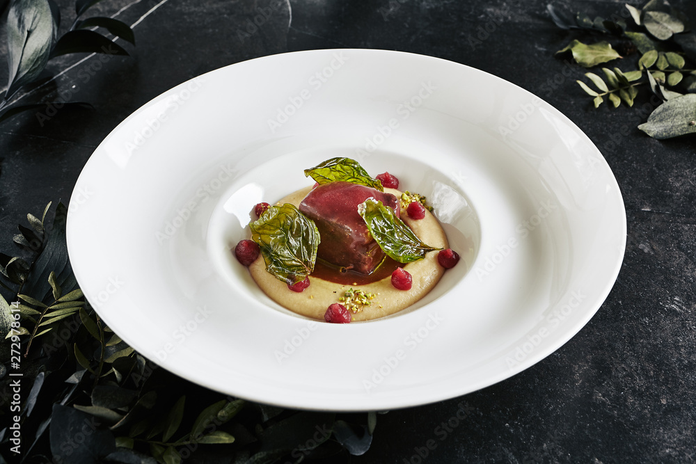 Restaurant Plate of Beef Cheeks in Cherry Glaze with Potato-Celery Cream and Sauce of Dried Berries Restaurant Plate of Beef Cheeks in Cherry Glaze with Potato-Celery Cream and Sauce of Dried Berries