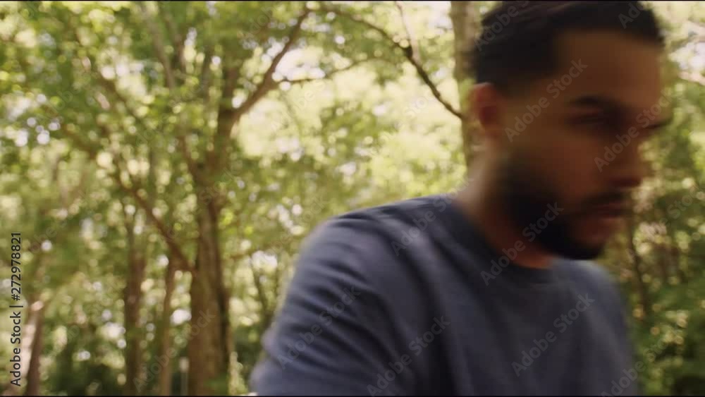 Young man running checking smartwatch during workout Young man running checking smartwatch during workout