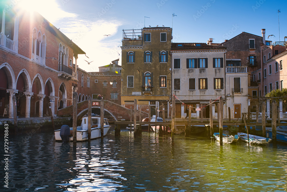 Fototapeta premium Sunny winter day in Venice, shot from channel