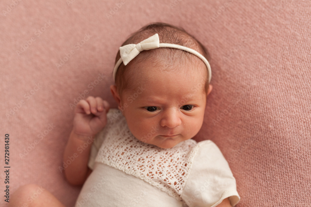 Sleeping newborn baby girl on pink background Sleeping newborn baby girl on pink background