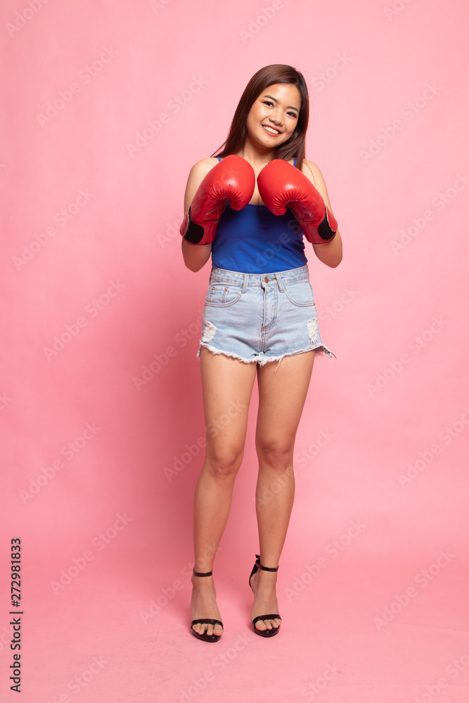 Full body of beautiful young asian woman with red boxing glove Full body of beautiful young asian woman with red boxing glove