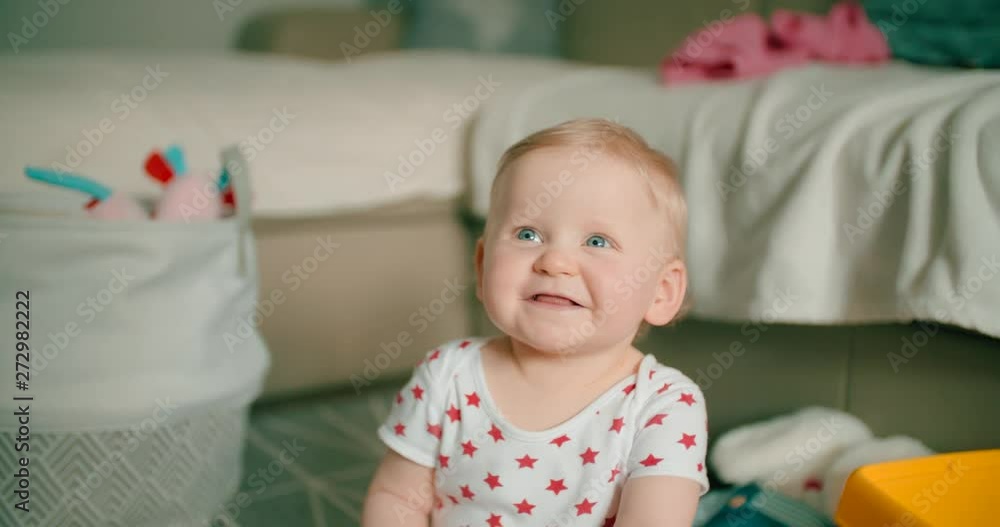 Little curious baby girl smiling slow motion Little curious baby girl smiling slow motion