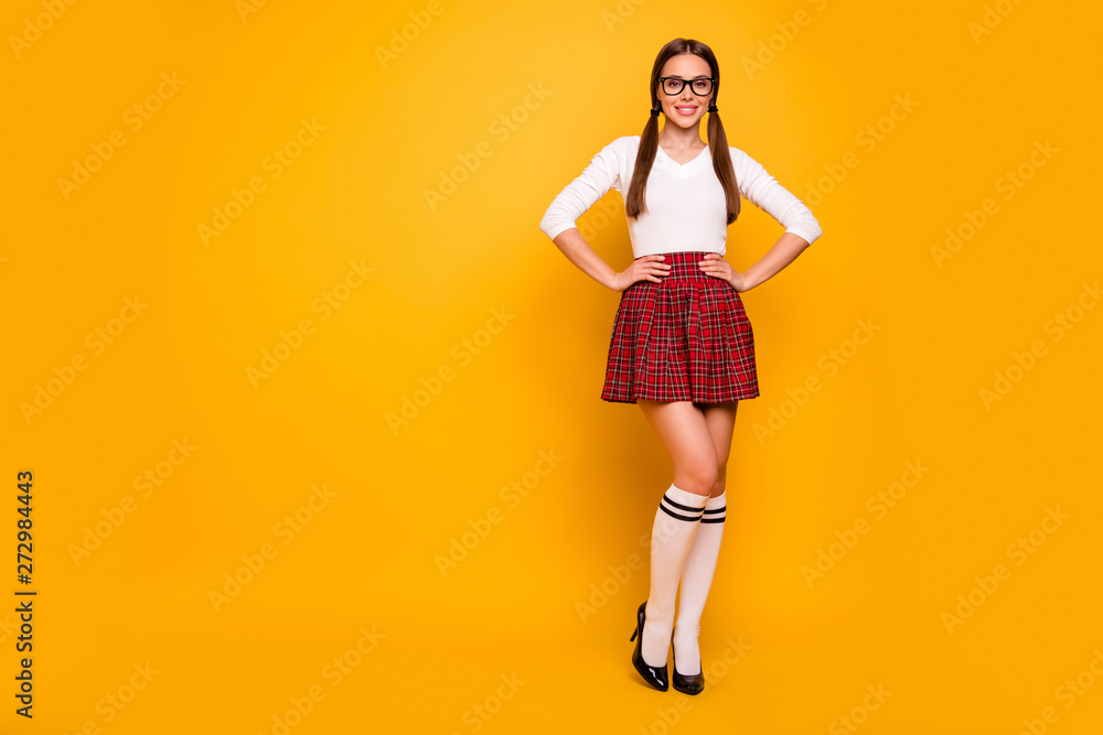Full length body size view of nice attractive lovely lovable glamorous feminine cheerful confident content girl wearing new clothing collection isolated over bright vivid shine yellow background Full length body size view of nice attractive lovely lovable glamorous feminine cheerful confident content girl wearing new clothing collection isolated over bright vivid shine yellow background