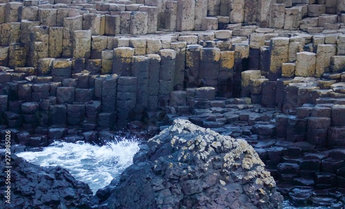View of the Rocks of Giants Causeway with sea sprayed rocks and Ocean