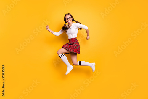 Full length body size view portrait of her she nice attractive lovely cheery cheery glad girl wearing eyeglasses eyewear rapid rush hour sale discount isolated on bright vivid shine yellow background