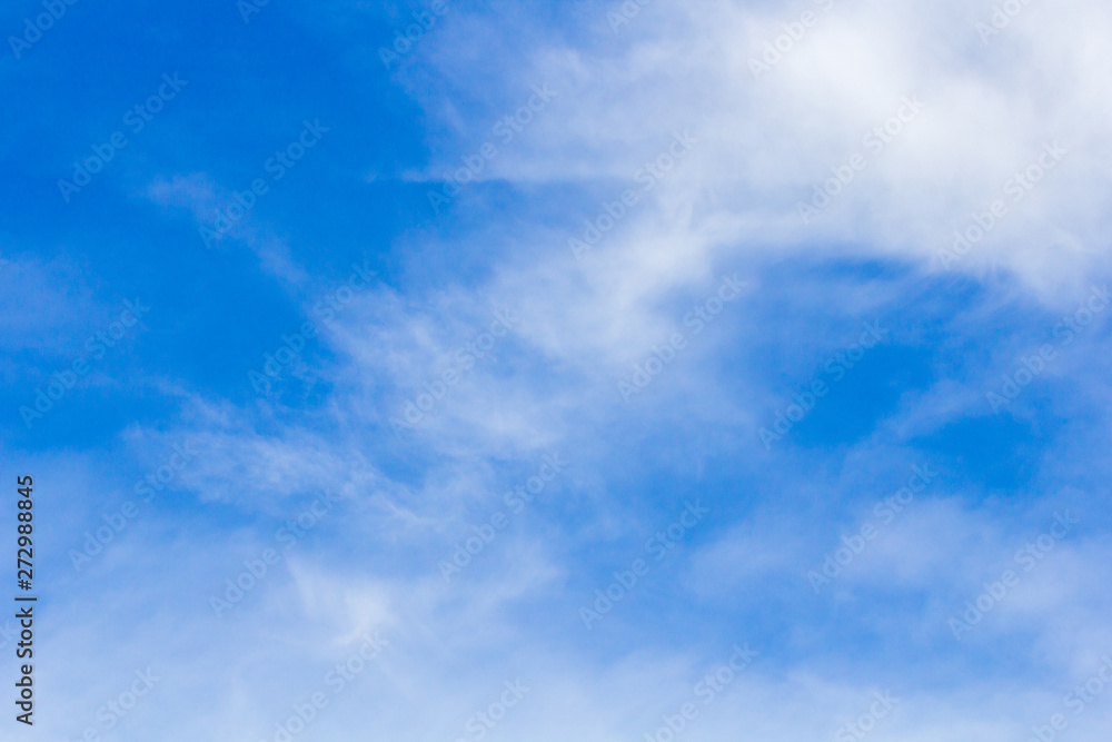 White clouds with blue sky background.