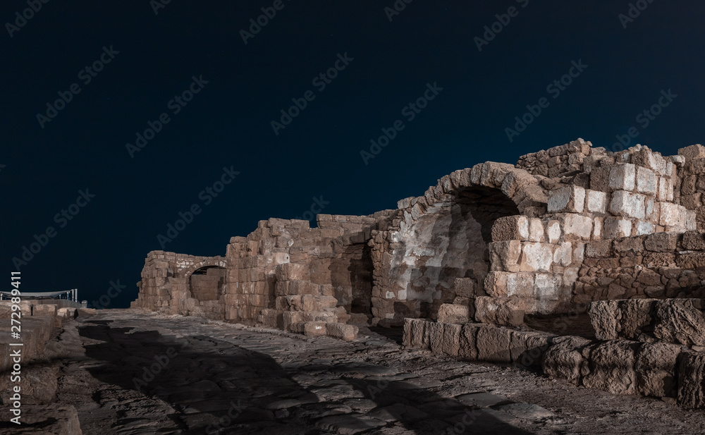 Night view of the ruins of Caesarea city on the Mediterranean coast, which was built by the king of Judea, Herod the Great, in honor of the Roman emperor Caesar Augustus