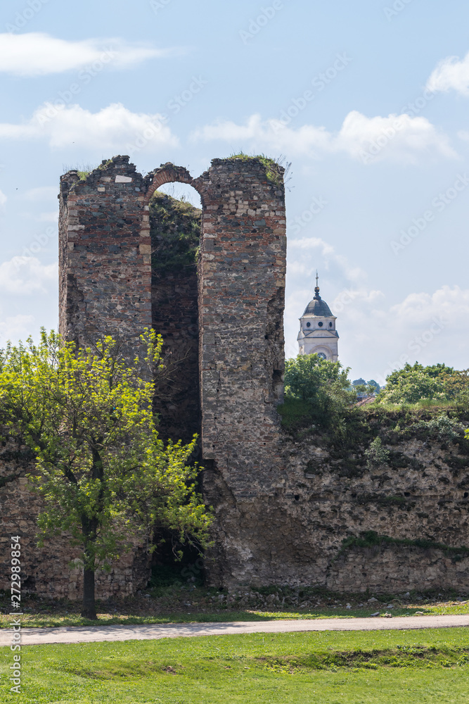 The  remains of the fortress wall and the clock tower in the ruins of the Smederevo fortress, standing on the banks of the Danube River in Smederevo town in Serbia.