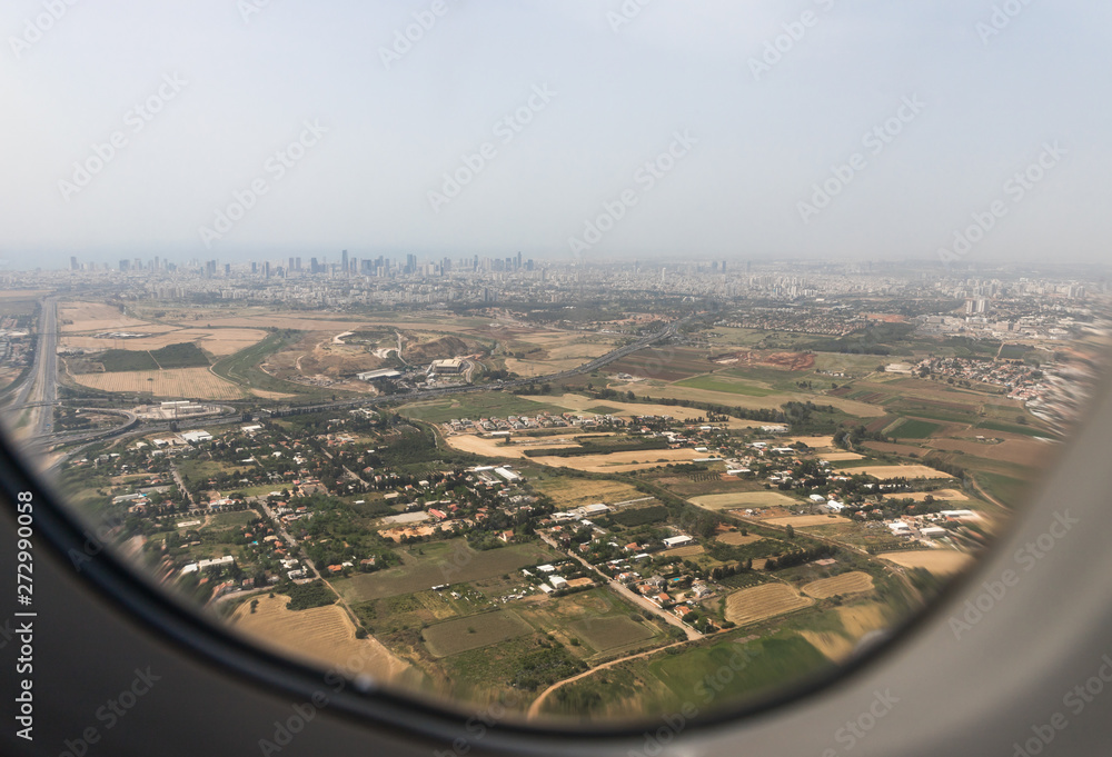 View of the suburbs of Tel Aviv from the window of a flying airplane, near Tel Aviv in Israel