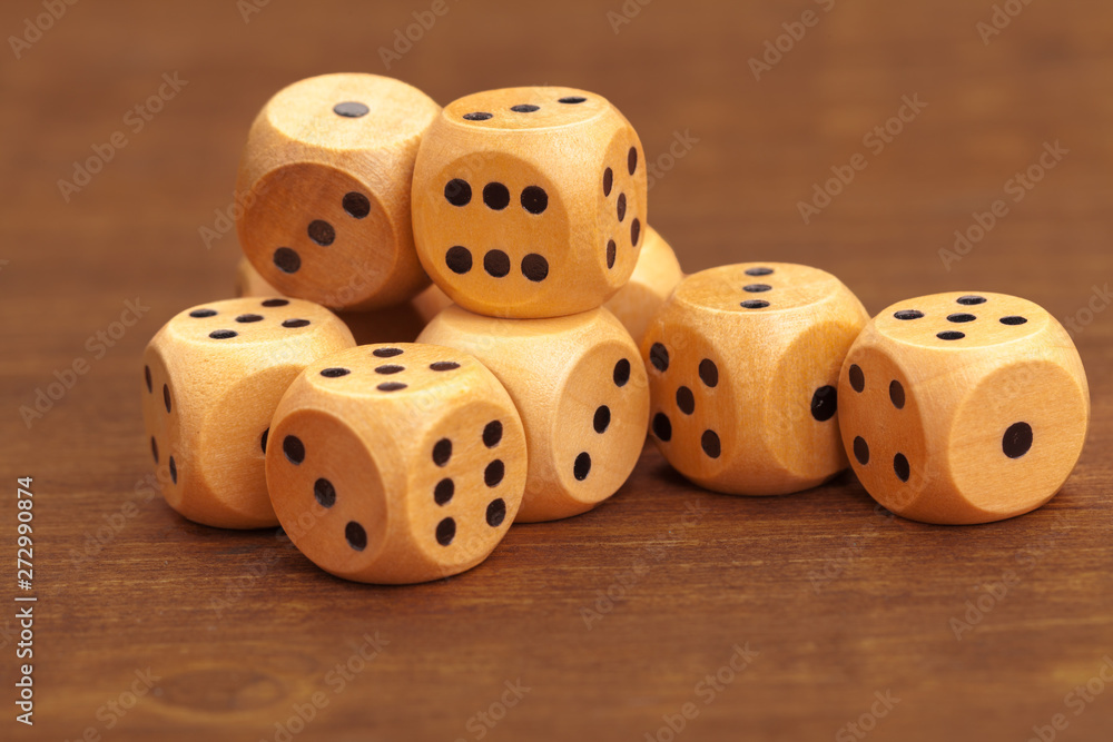 Dice on a wooden table. Concept for business risk. Dice on a wooden table. Concept for business risk.