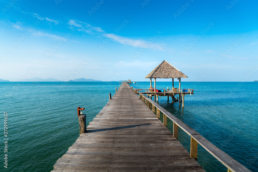 Long wooden bridge in beautiful tropical island beach - Koh Mak in Trat, Thailand.