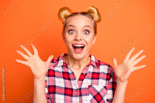 Close up photo attractive yelling she her lady hands arms raised air see sale discount low prices black friday ecstatic astonished wear casual checkered plaid pink shirt isolated orange background