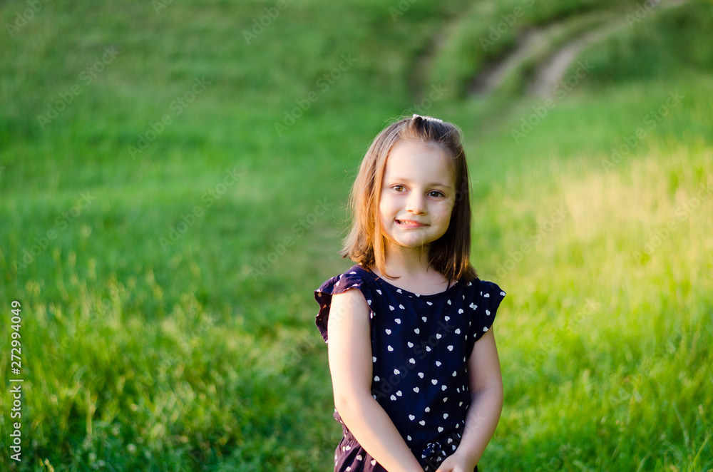 Sweet little girl outdoors with bob haircut. Copyspace. Summer time Sweet little girl outdoors with bob haircut. Copyspace. Summer time