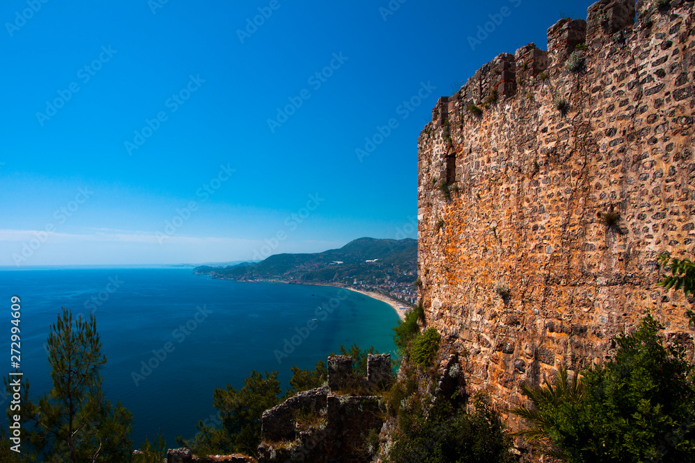 Beautiful view of the Mediterranean Sea, the mountains, the forest, the city and the old fortress. Turkey, Alanya.