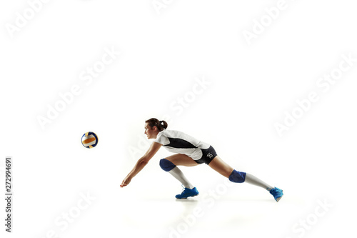 Young female volleyball player isolated on white studio background. Woman in sport s equipment and shoes or sneakers training and practicing. Concept of sport  healthy lifestyle  motion and movement.