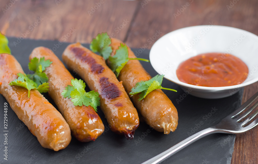 delicious pork fried sausages served with herbs and sauce delicious pork fried sausages served with herbs and sauce