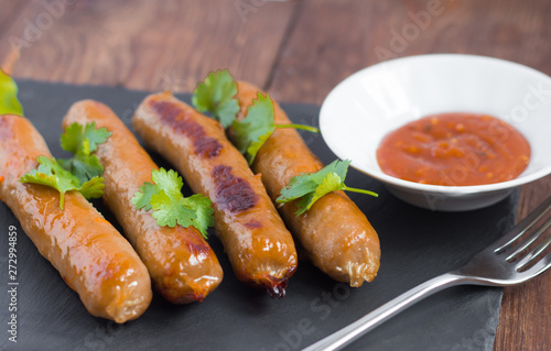 delicious pork fried sausages served with herbs and sauce
