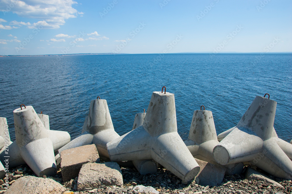 breakwater on the river in summer blue sky breakwater on the river in summer blue sky