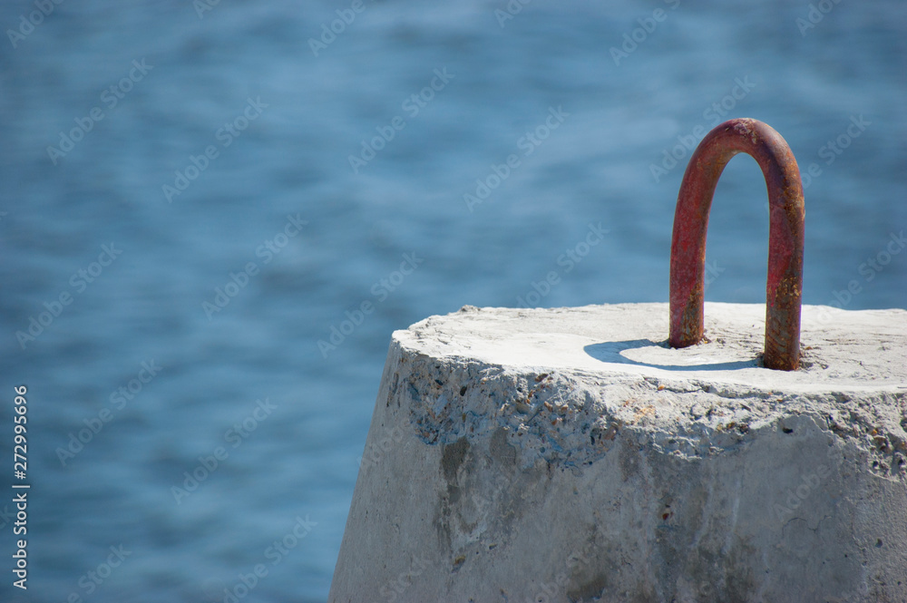 Fototapeta premium breakwater on the river in summer blue sky macro