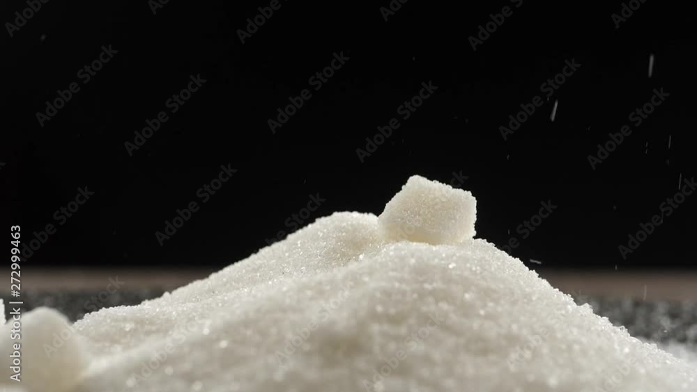 sugar cubes fall on a pile of sugar sugar cubes fall on a pile of sugar