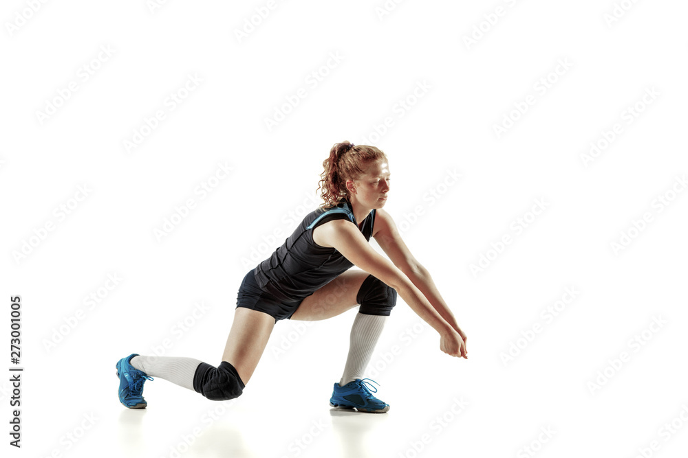 Young female volleyball player isolated on white studio background. Woman in sport's equipment and shoes or sneakers training and practicing. Concept of sport, healthy lifestyle, motion and movement. Young female volleyball player isolated on white studio background. Woman in sport's equipment and shoes or sneakers training and practicing. Concept of sport, healthy lifestyle, motion and movement.