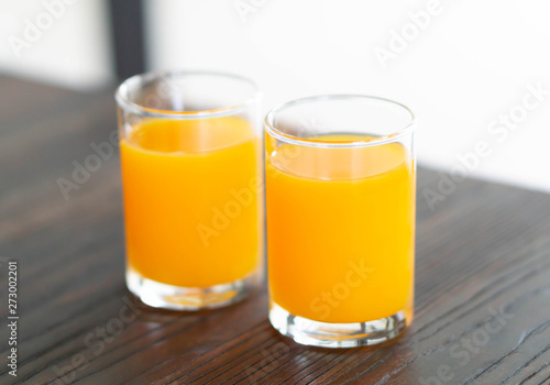 Closeup orange juice on wood table, drink for healthy concept, selective focus