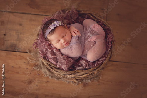 Little sleeping newborn baby girl