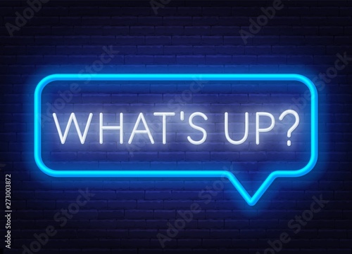Neon sign what's up in speech bubble frame on dark background. Light banner on the wall background.