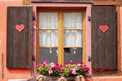 Traditional decorated window of half-timbered house in Alsace region