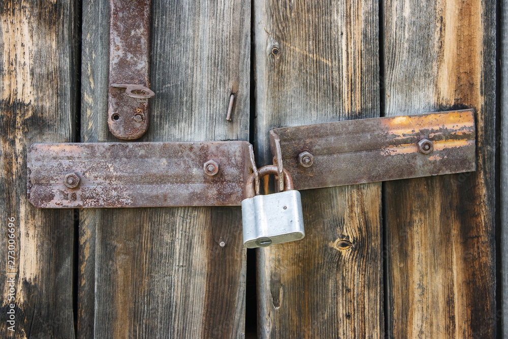 lock on the old wooden gate lock on the old wooden gate