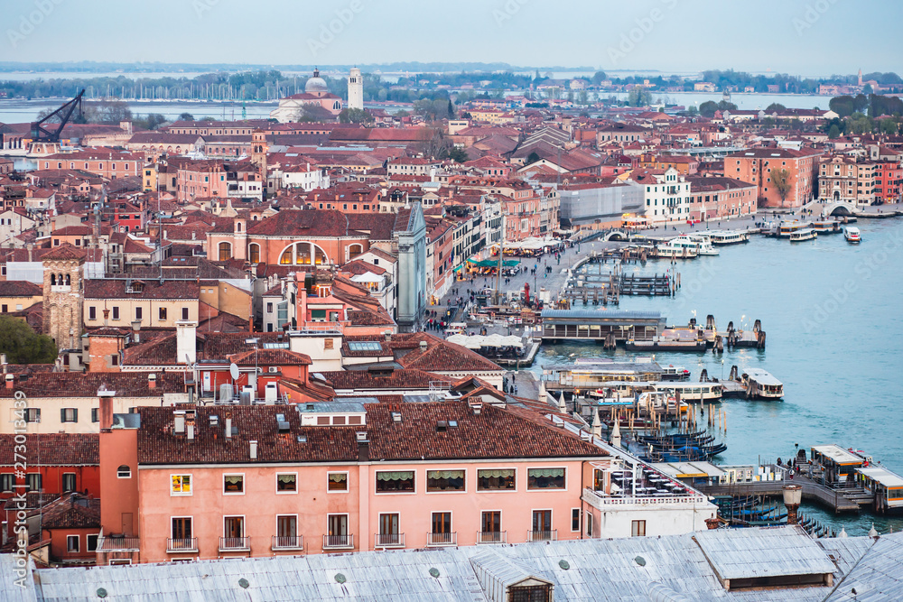 Obraz premium Beautiful super wide-angle aerial view of Venice, Italy with harbor, islands, skyline and scenery beyond the city, seen from the observation tower of St Mark's Campanile
