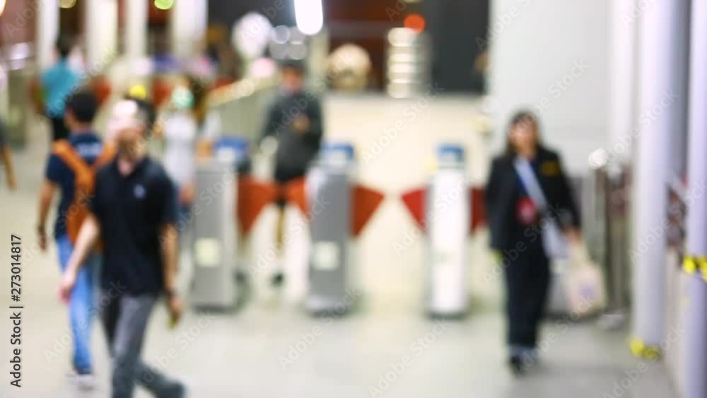 blurry of many people walking pass door access control. ticket automate in a BRT station at Bangkok, Thailand. blurry of many people walking pass door access control. ticket automate in a BRT station at Bangkok, Thailand.