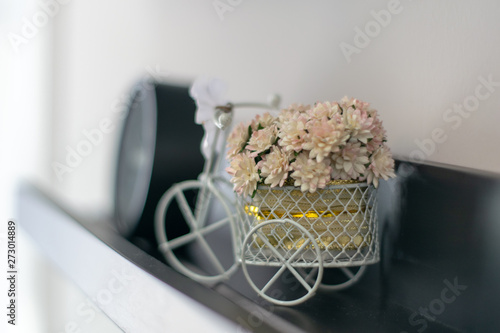 Small white flowers placed on a small basket