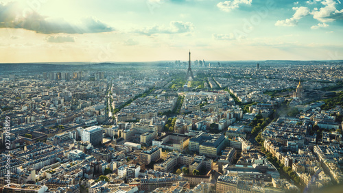 Paris street with view on the famous paris eiffel tower on a sunny day with some sunshine