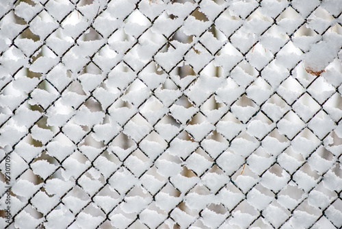 simple country fence under snow in winter