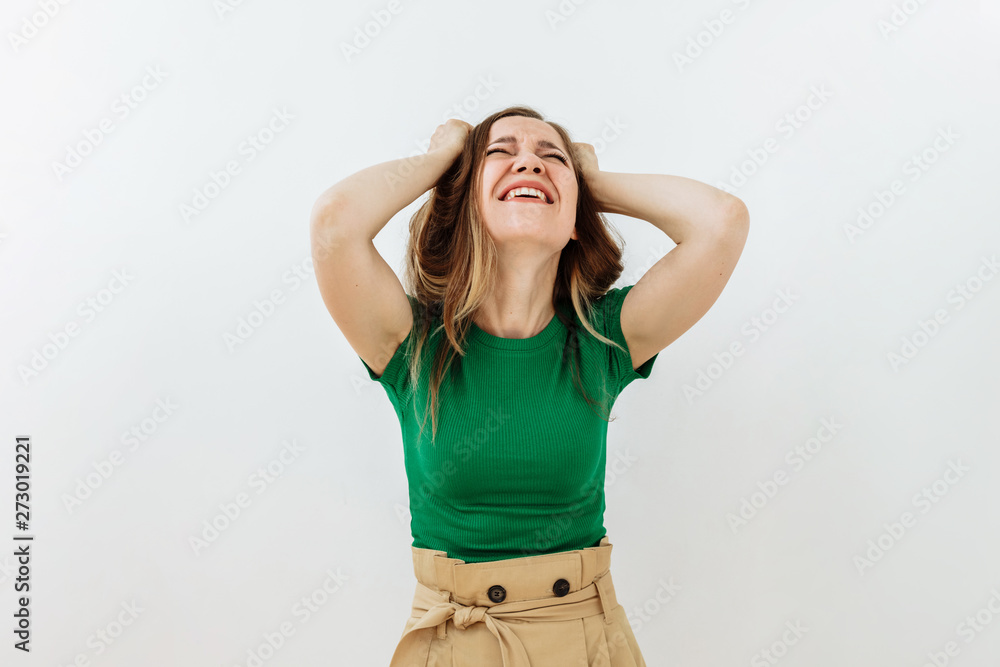 Frustrated and stress emotion. Portrait of brown hairl young woman against white background Frustrated and stress emotion. Portrait of brown hairl young woman against white background