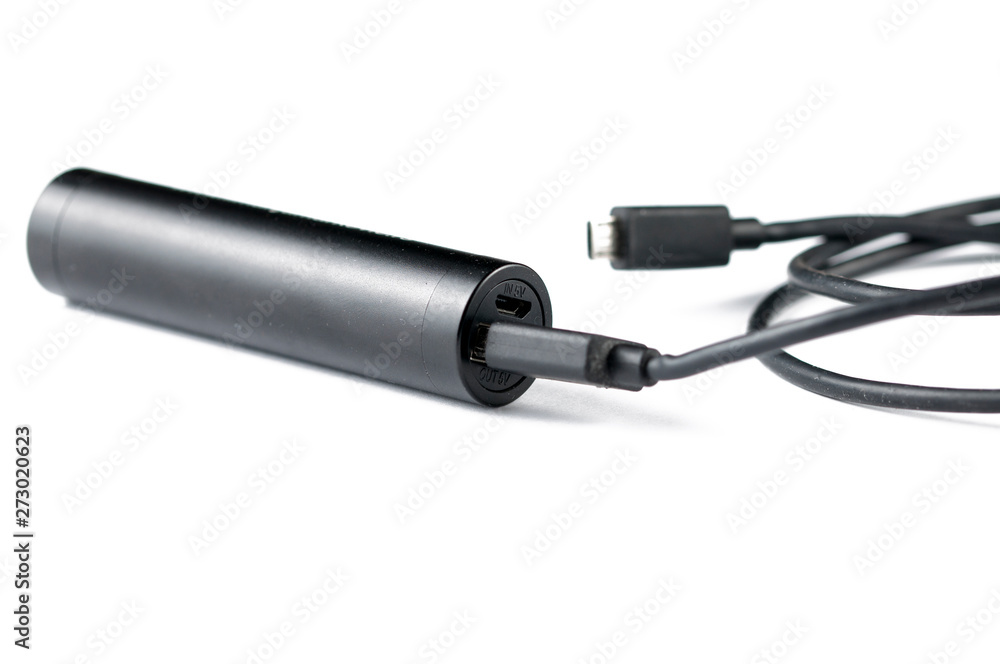 Black mobile charger isolated on white background.Copy space Black mobile charger isolated on white background.Copy space